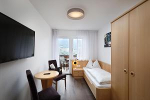 TV a/nebo společenská místnost v ubytování Hotel Garni Herz