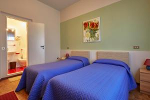 Postel nebo postele na pokoji v ubytování ALBERGO EUROPA