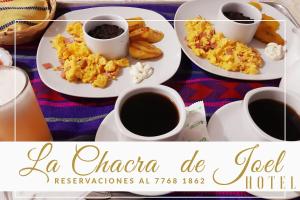 two cups of coffee and scrambled eggs on plates at La Chacra de Joel Hotel in Huehuetenango