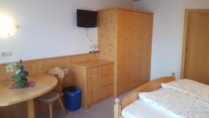 Ένα ή περισσότερα κρεβάτια σε δωμάτιο στο Gasthof Walde