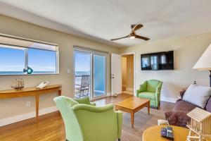 a living room with a view of the ocean at Turtle Beach Retreat in Layton