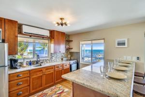 a kitchen with a large island with a counter top at Turtle Beach Retreat in Layton