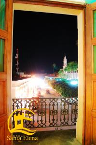 a view of a street at night from a balcony at Hotel Santa Elena in El Fuerte