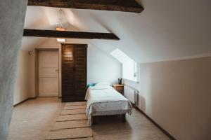 a bedroom with a bed in the middle of a room at Hostel Uskumatu in Paide