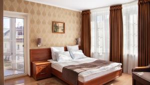 Un pat sau paturi într-o cameră la Villa Marta