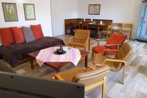 a living room with a couch and chairs and a table at Mayenzett 34 in Leukerbad