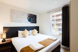 Ένα ή περισσότερα κρεβάτια σε δωμάτιο στο Staycity Aparthotels Edinburgh West End