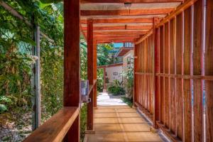 a wooden walkway leading down to a house at AroCocles (Paula) in Cocles