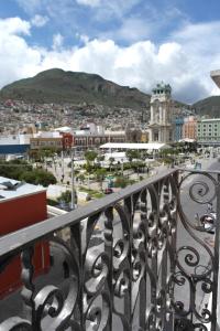 a view of a city from a balcony at Hotel de los ba&ntilde;os in Pachuca de Soto