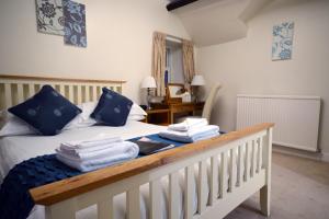 a bedroom with a bed and a desk at Southview Guest House and Indoor Pool in Windermere