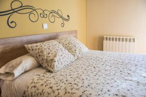 Posteľ alebo postele v izbe v ubytovaní Hostal La Pastora