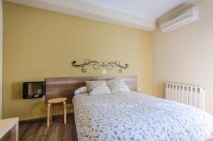 Posteľ alebo postele v izbe v ubytovaní Hostal La Pastora