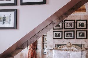 a staircase with pictures on the wall at Le Monde Hotel in Edinburgh