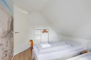 A bed or beds in a room at Vakantiewoning Seaewald