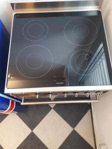 a stove top oven sitting on a metal shelf at SUB 14 Suite Apartment - Vietato Fumare in Reggio Emilia