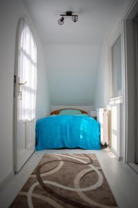 Postel nebo postele na pokoji v ubytování Günter Vendégház-Hajdúnánás