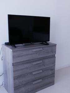 TV a/nebo společenská místnost v ubytování apartamento na praia