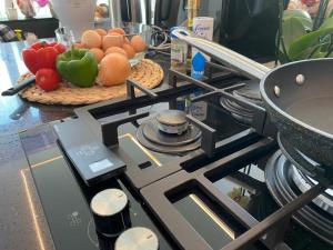 a stove top with fruits and vegetables on a counter at B&B Am Gardasee blick in Limone sul Garda
