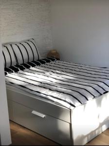 Posteľ alebo postele v izbe v ubytovaní SC design Home Apartman