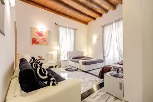 a living room with a couch and a bed at MyTimeRome in Rome