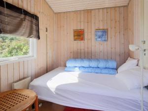 A bed or beds in a room at 6 person holiday home in J gerspris