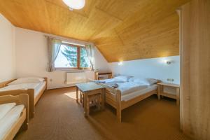 Postel nebo postele na pokoji v ubytování Horský Hotel Kohútka