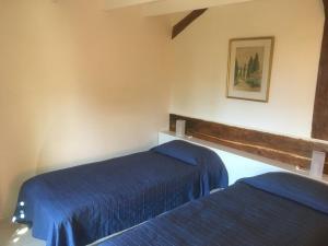 A bed or beds in a room at Le Clos des May