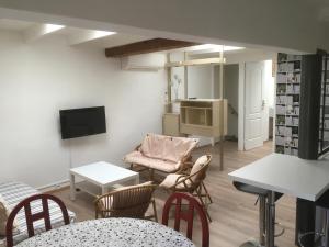 A television and/or entertainment centre at Le Clos des May