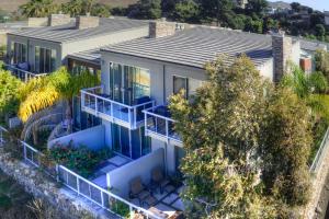 an aerial view of a house with blue balconies at 219 San Miguel in Avila Beach