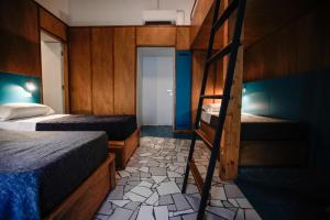 Katil atau katil-katil dalam bilik di NAP Hostel Spaccanapoli