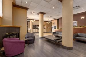 a lobby of a hospital with couches and chairs at GEC Granville Suites Downtown in Vancouver