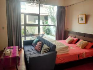 Voodi või voodid majutusasutuse Formosa Backpackers Hostel & Apartment（青年民宿） toas