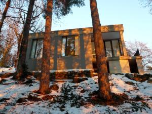 a house in the woods in the snow at Varesello 20 in Brunate