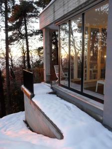 a house with snow on the porch at Varesello 20 in Brunate +57 photos