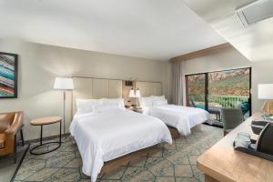 A bed or beds in a room at Matterhorn Inn