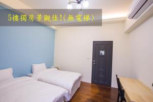 Postel nebo postele na pokoji v ubytování Fantasy Homestay