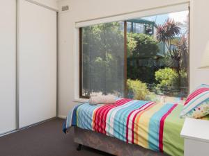 Un ou plusieurs lits dans un hébergement de l'établissement Waikiki Dream