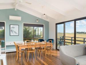 a dining room with a table and chairs at Beulah in Ventnor