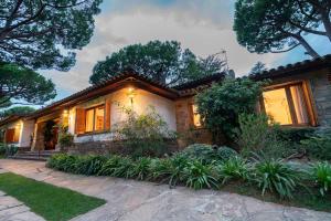 a house with a pathway in front of it at Villa Can Duarry - Barcelona Country House 1 in Premia de Dalt