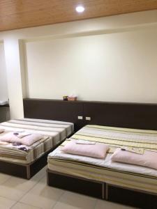 Postel nebo postele na pokoji v ubytování Dongyin Homestay連江縣民宿054號