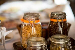 a group of jars of food sitting on a table at Pałac Piorunów & Spa in Kwiatkowice