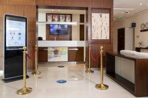 TV a/nebo společenská místnost v ubytování Action Hotel Ras Al Khaimah