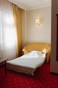 Postel nebo postele na pokoji v ubytování Hotel Jakub Sobieski