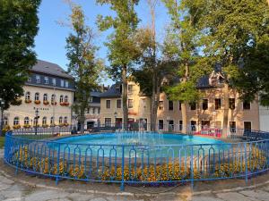 a large fountain in front of a building at Pension Glückauf in Kurort Oberwiesenthal