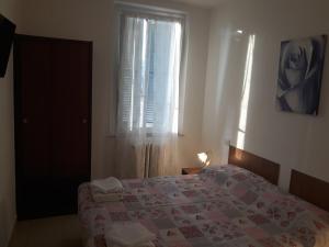 Postel nebo postele na pokoji v ubytování Hotel La Torretta