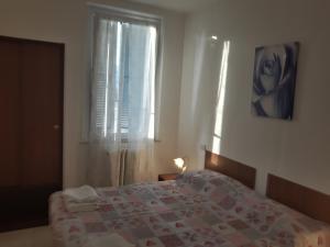 Postel nebo postele na pokoji v ubytování Hotel La Torretta + 14 fotografií