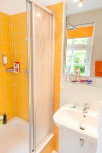 a bathroom with a shower and a sink at Hotel Ostseeländer in Züssow