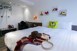 Ένα ή περισσότερα κρεβάτια σε δωμάτιο στο Norway Forest Travel hotel 1 Taichung