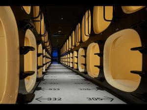 a hallway with rows of seats in an airplane at 9h nine hours Hakata station in Fukuoka