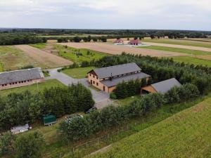 an aerial view of a farm with a building at Arka Agroturyska in Kosin